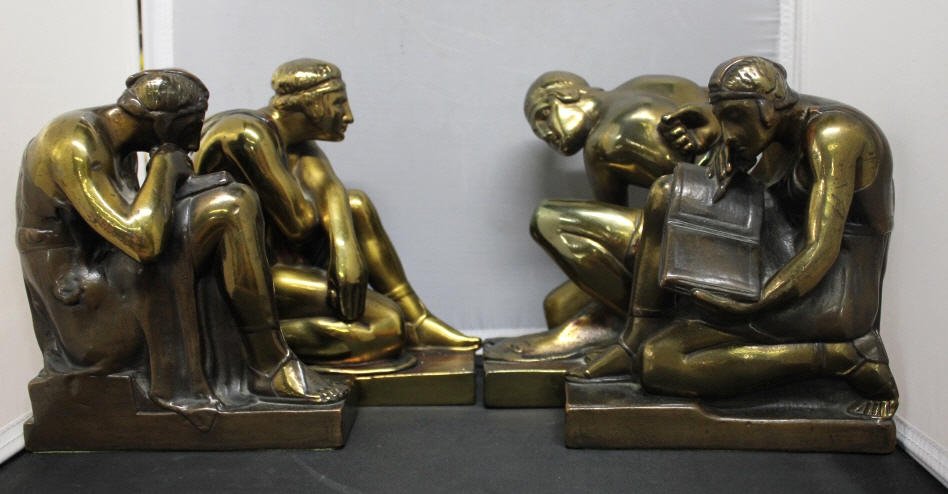 Four Antique Art Deco Bookends Pompeian Bronze: Pompeian Bronze sticker on bottom. Height of tallest 7.5 inches.
