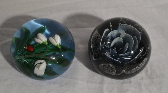 Two Glass Paperwieghts. Floral signed: Comprising one paperweight signed Caithness Scotland limited edition and the other monogrammed on the bottom and dated 1989.