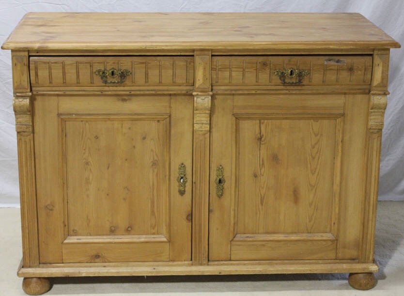 Antique Pine Cottage Victorian Buffet: Having two drawers over two cabinet doors on bun form feet. Natural pine finish. Height 35 inches. Length 48.5 inches. Width 22.5 inches. Property of a Mamaroneck NY Estate.