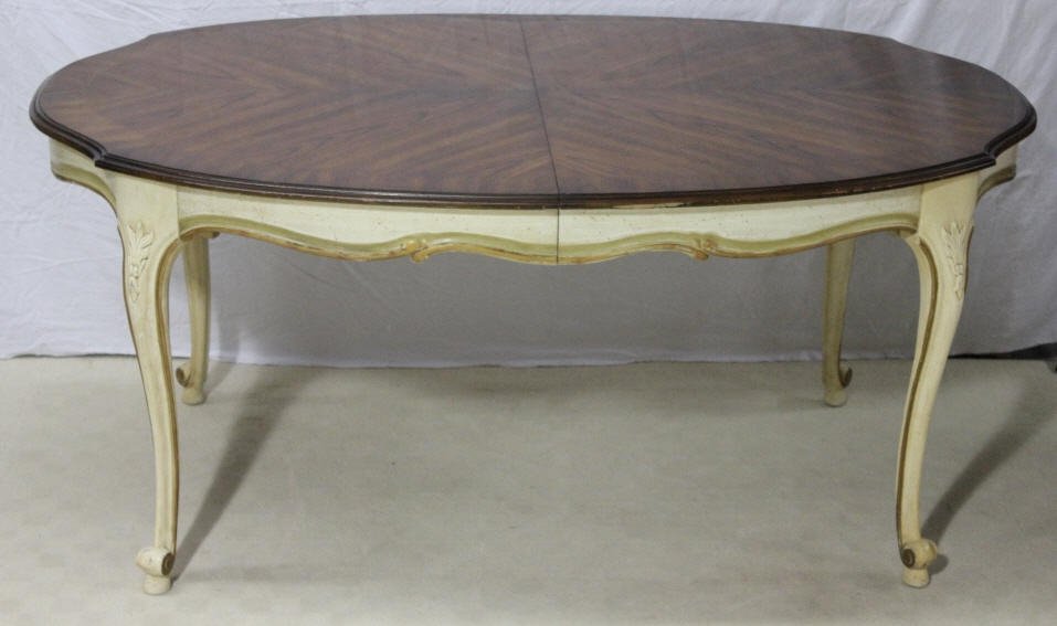 Mid Century French Provencal Style Dining Table: Includes 2 leaves. Without leaves table measures: Length 65 inches. Height 29.5 inches. Property of a Bedford Hills NY Home. Width 43.5 inches.