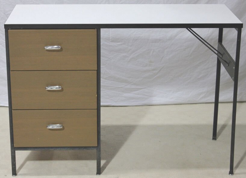 Vintage George Nelson Herman Miller Desk: Paper and brass labels attached on underside. The sek with metal frame and left side drawers. Height 30 inches. Length 42 inches. Depth 17 inches.