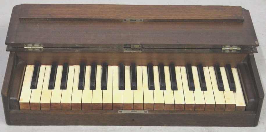 Antique Child Size Table Top Piano: Height 5 inches. Length 24 inches. Depth 14 inches. Property of the Gulbenkian estate Pelham NY.