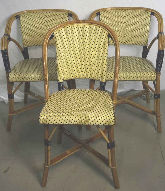 Set of Rattan & Wood Bistro Chairs By Druker: 2 arm chairs 2 side chairs. Height 32 inches. Width 21 inches. Depth 19 inches. Property of an Upper East Side Duplex.