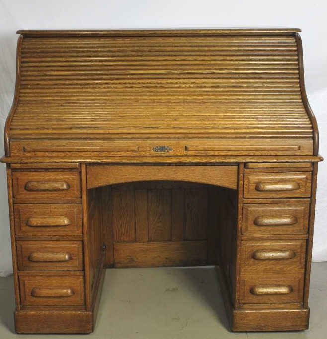 American Golden Oak Roll Top Desk Circa 1890: Height Width 48 Inches Roll top with fitted interior of cubby holes and letter drawers. The base of drawers and writing slides Refinished with slightly darker stain. Property of an Upper East Side Dup