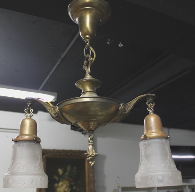 Pair Art Deco Style Electric Light Fixtures: Having brass supports with two hanging lights frosted glass shades. Length 24 Inches. Property of an Upper East Side Duplex.