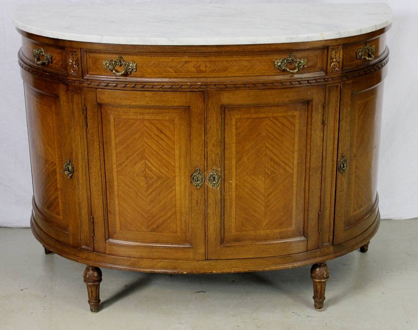 Demi-lune Console Cabinet Marble Top.: Custom Regency style having a conforming marble top over a base cabinet with drawers and cabinet doors on four tapered feet. Height 35 inches width -45 inches depth 21 inches. Property of an Upper Eas