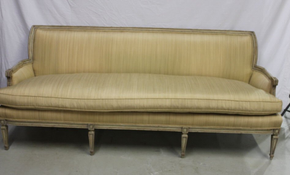 Louis XVI Style Carved Upholstered Sofa.: Length 80 inches. Height 32 inches. Depth 31 inches. Fine custom quality w. silk upholstery. Down blend pad upholstery seat. Frame is carved wood with antique finish. Having a beaded mold crest rail &