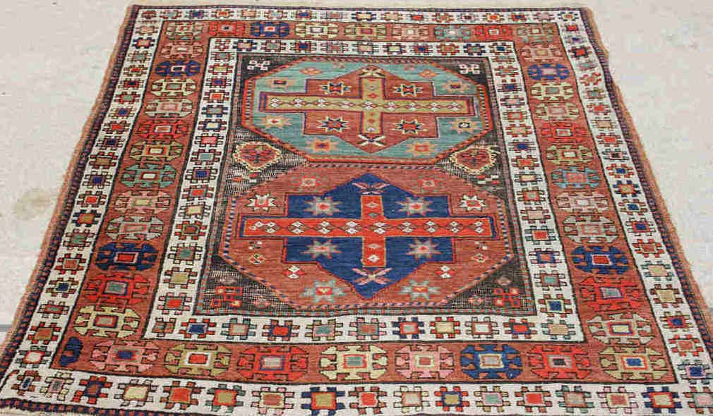 Antique Tribal Kazak Carpet 4 x 5': Measures 4 feet by 5 feet. Two geometric medallion on red oxide ground.