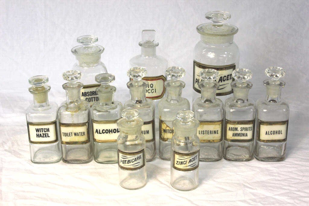 Group of 13 Glass Apothecary Jars: All with stoppers. Tallest 8 inches.
