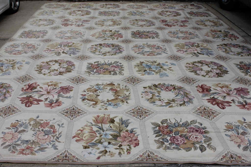 Contemporary Needlepoint Carpet By Stark: Measures 11.10 feet by 18.10 feet by Stark Carpet. Having an ivor4y ground alternating "tile" of floral motif. Property of a Bedford Hills NY Home.