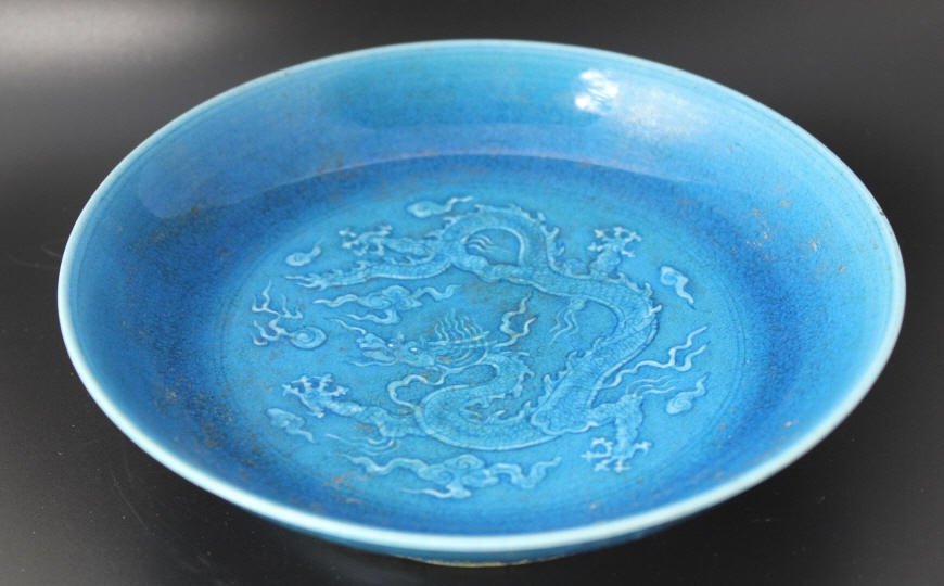 Chinese Porcelain Turquoise Shallow Bowl: Chinese Porcelain Turquoise Shallow Bowl Crackle robin egg blue porcelain w. dragon at center. Signed on bottom. Height 1.5 inches. Diameter 6 inches.