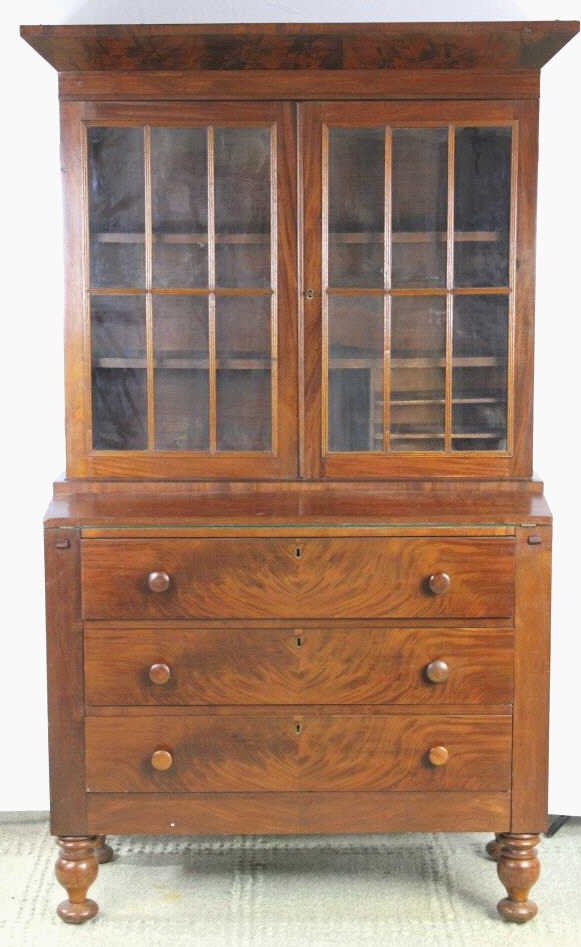 Antique American Empire Cabinet, C. 1840.: Antique American Empire Style Cabinet Height 72 inches. Width 40 inches. Depth 16 inches. Two door paned glass doors, 3 drawers. Front opens up to secretary.