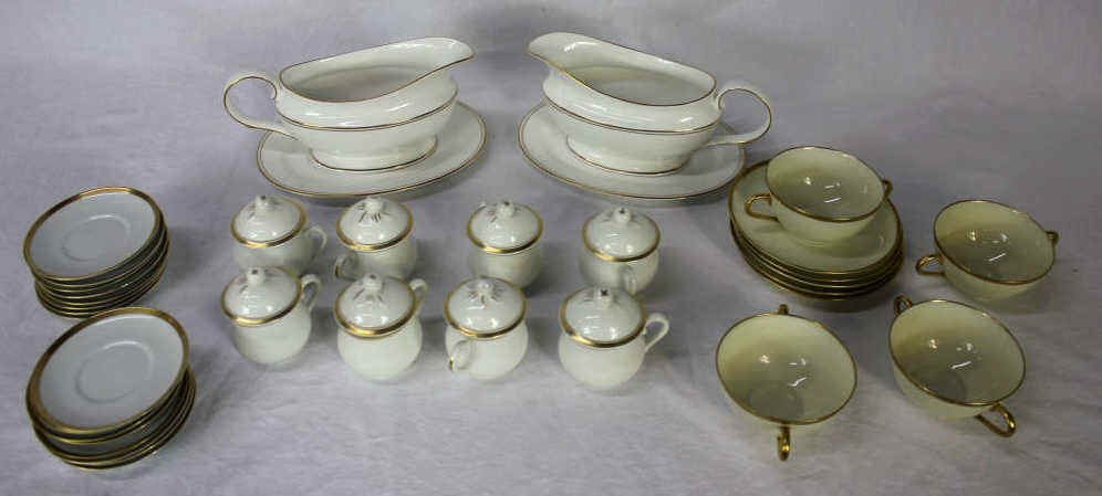 Assorted Porcelain Black Knight, VA, Lenox and FF: Thirty-two in total. Four Black Knight teacups and four saucers. Eight Vista Alegre (VA) Portugal pots de creme with lids. Two Lenox gravy boats. Fitz and Floyd (FF) Japan sixteen small saucers. Gold