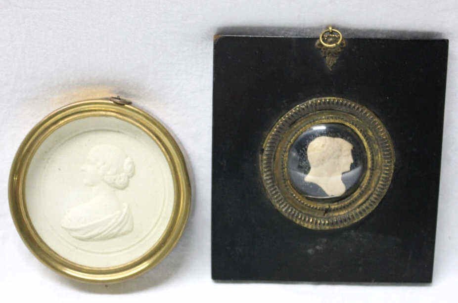 Two Antique Reliefs in Frames: Mark Antony and Cleopatra, and Bust of Jenny Lind. Mark Antony Relief 3 Inches. Frame Height 5.5 Inches Width 5 Inches Lind Relief Height 4.5 Inches