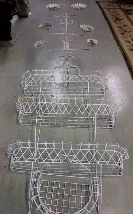 Group of Five Window Flower Boxes and Plant Stand: Three long wire window flower boxes, one semi-circular wire flower box, and one three-tier wrought iron plant stand, all painted white. Long Height 21.5 Inches Width 39 Inches Depth 8.5 Inches Semi-Ci
