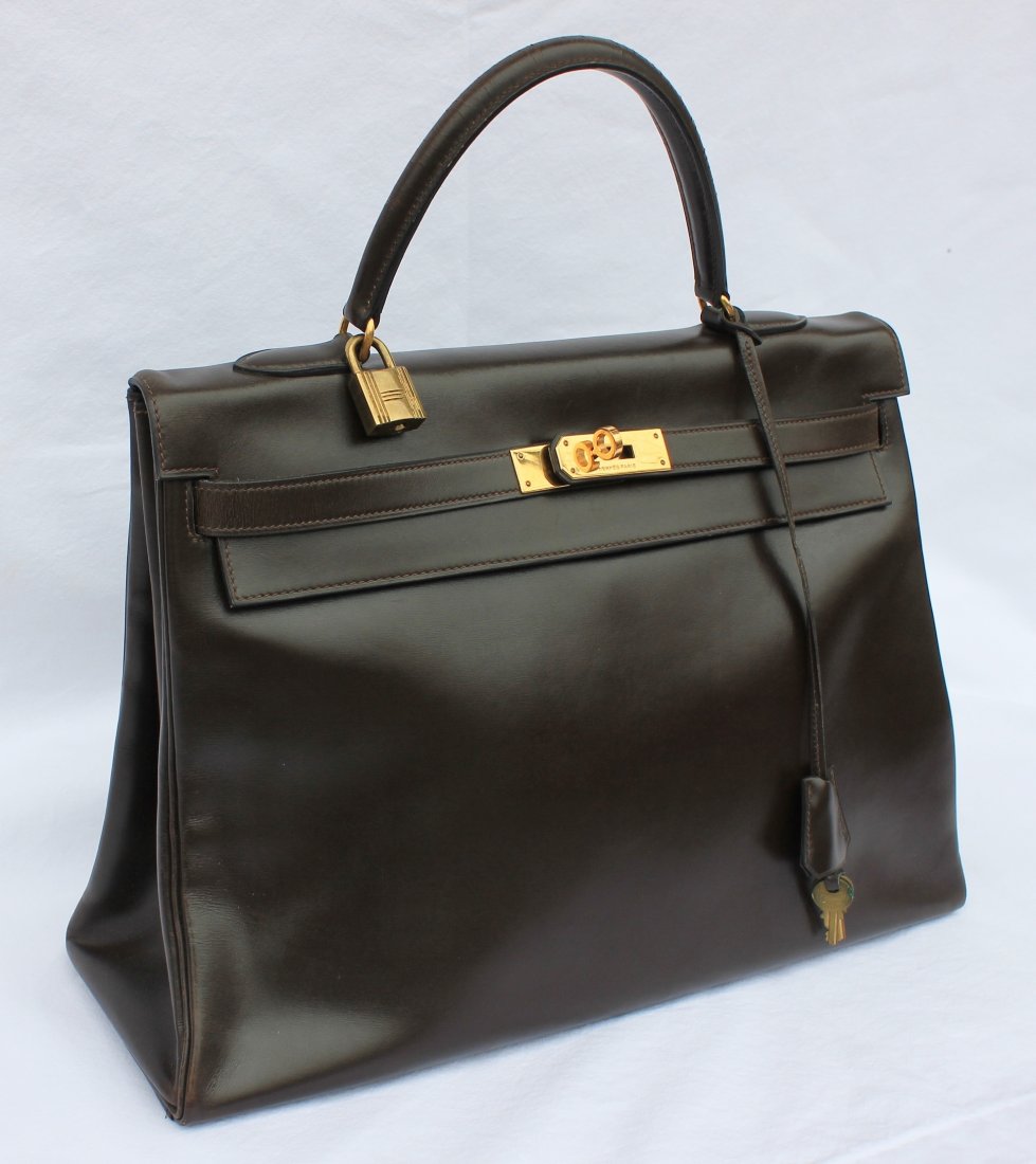 Hermes Kelly Bag with Original Lock and Key: in Chocolate Brown Height 10 Inches. Width 13.5 Inches. Property of a Westport, CT estatehas date stamp of H encircled (19780