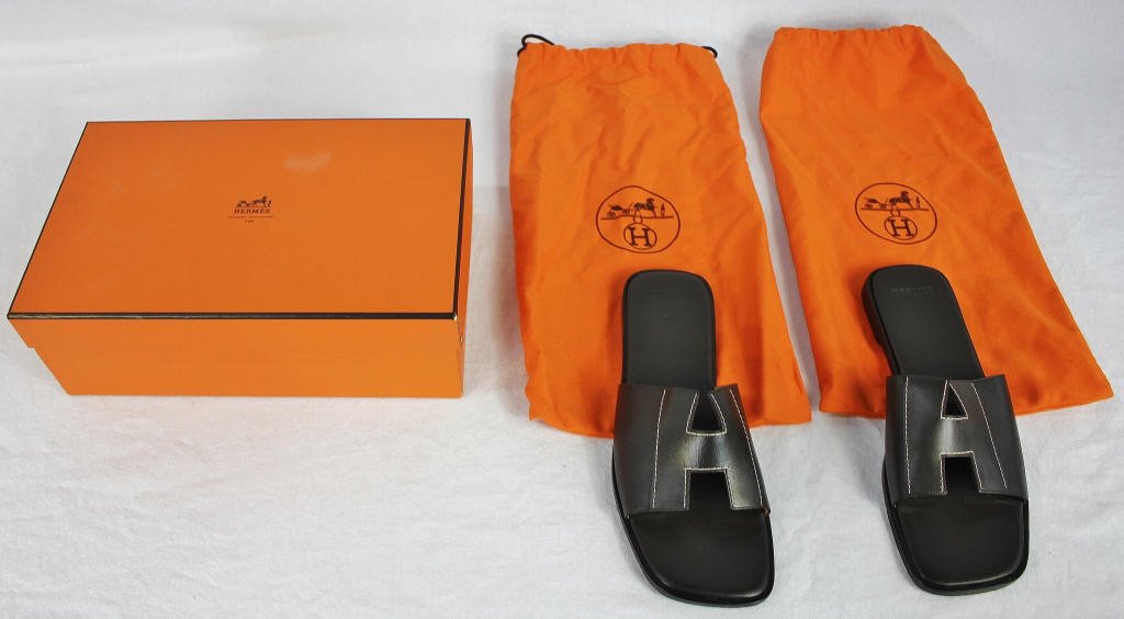 Hermes Oran "H" Sandals in Black: In box with protective pouch. Size 40. Property of a Westport, CT estate