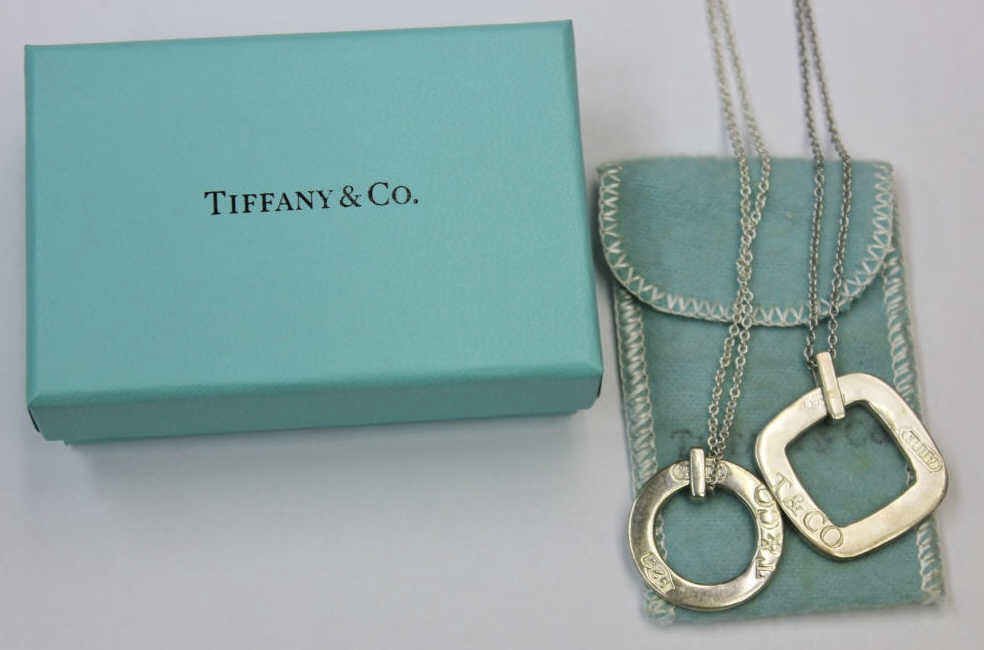 Two Tiffany & Co. Sterling Silver Necklaces: One square pendant and one circular pentant. Property of a Westport, CT estate