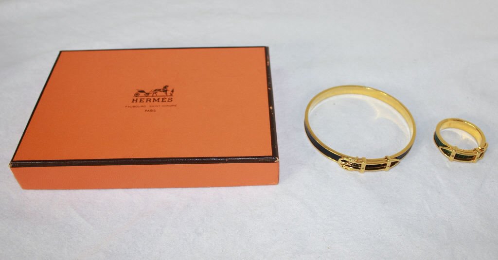 Hermes Bracelet and Scarf Ring: Both in the form of belts. One black, one green. Reptile textured. In original box. Property of a Westport, CT estate