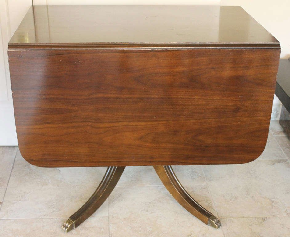 Drop Leaf Mahogany Claw Foot Table: Height 29.5 Inches Width 36 Inches Depth approximately 58 Inches