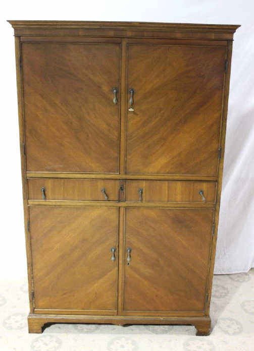 Four Door Chest with Sliding Secretary Desk: Needs repair. Height 65 Inches Width 41 Inches Depth 23 Inches