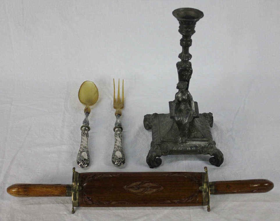Pewter Candlestick, Carving Set and Utensils: Wood and brass carving set. Pewter candlestick with female seated figure. Fork and spoon with sterling silver handles Candlestick Height 11 Inches Width 5.5 Inches