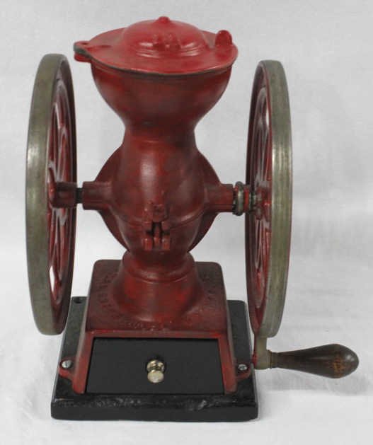 Antique American Kitchen Grinding Machine: With crank, compartment at bottom and receptacle at top. Height 13 Inches Width 10 Inches Depth 9 Inches