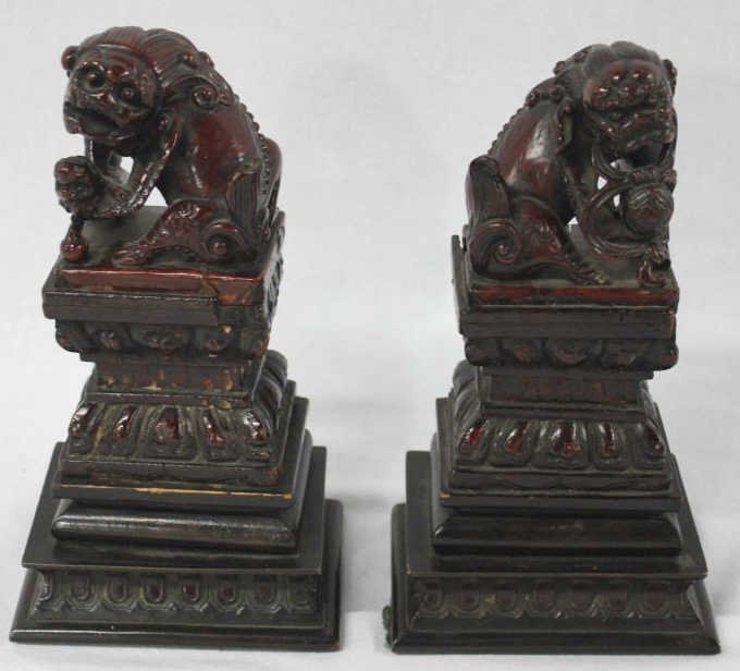 Pair of Antique Asian Carved Wood Bookends: on Bronze Base, in the form of Foo dogs or Foo lions. Height 10 Inches Width 5 Inches Depth 4 Inches
