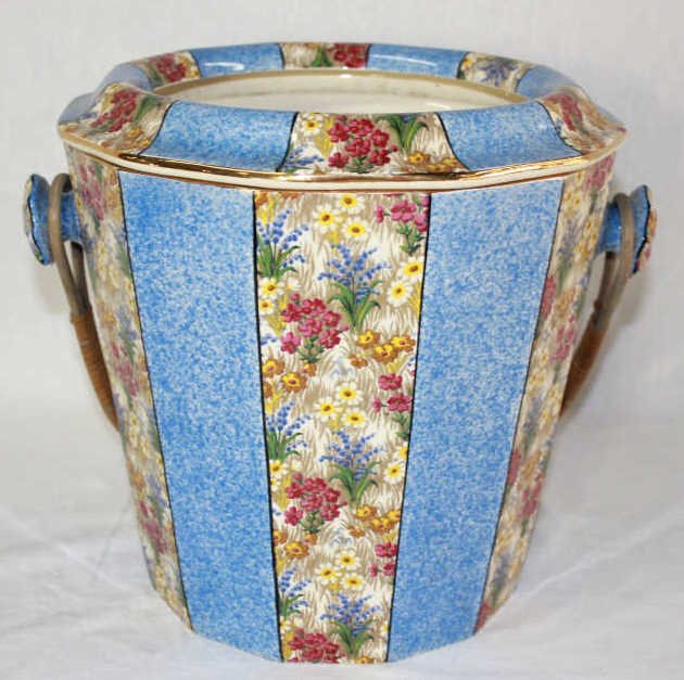 Porcelain Floral Garden Basket with Wicker Handle: Decorated with blue and floral panels Height 12 inches Width 11 inches