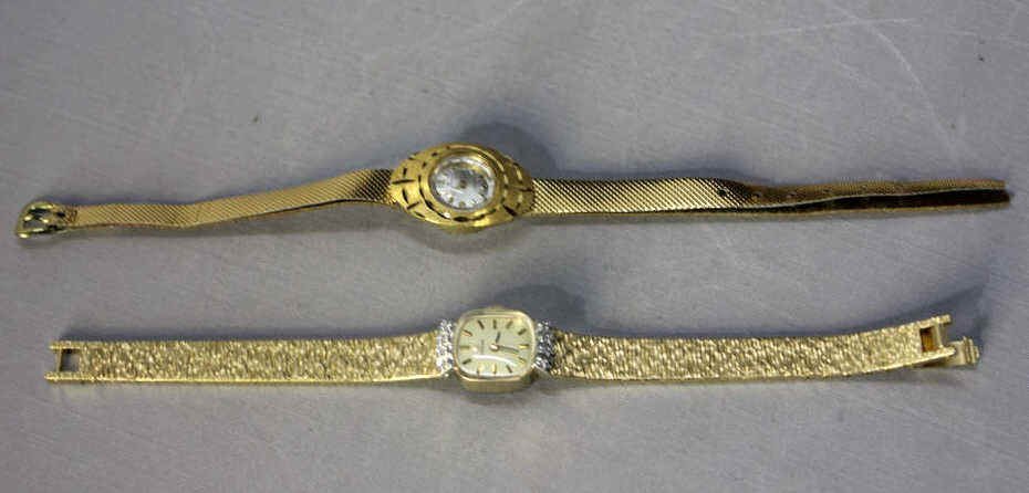 Ladies Omega and Bucherer Gold Watches: Omega 14kt gold and diamond watch, four diamonds each side. Stainless steel backing. Length approx. 7 Inches Bucherer 14kt gold watch with leather band. Stainless steel backing. Length approx. 8 Inche