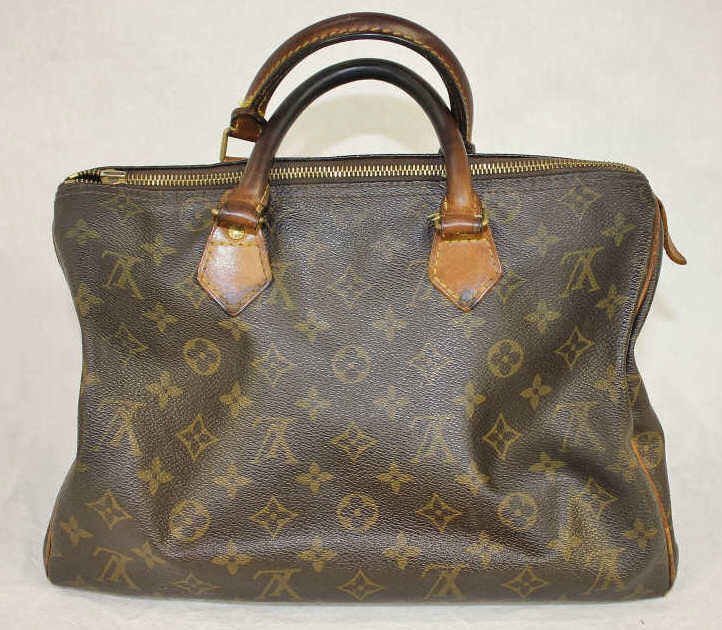 Louis Vuitton Used Satchel Bag: Property of a Westport, CT estate Classic Louis Vuitton monogram leather canvas Height 9.5 Inches. Width 12.5 Inches. Depth approximately 7 Inches. Zipper Pull tag in pocket Louis Vuitton Lock and key