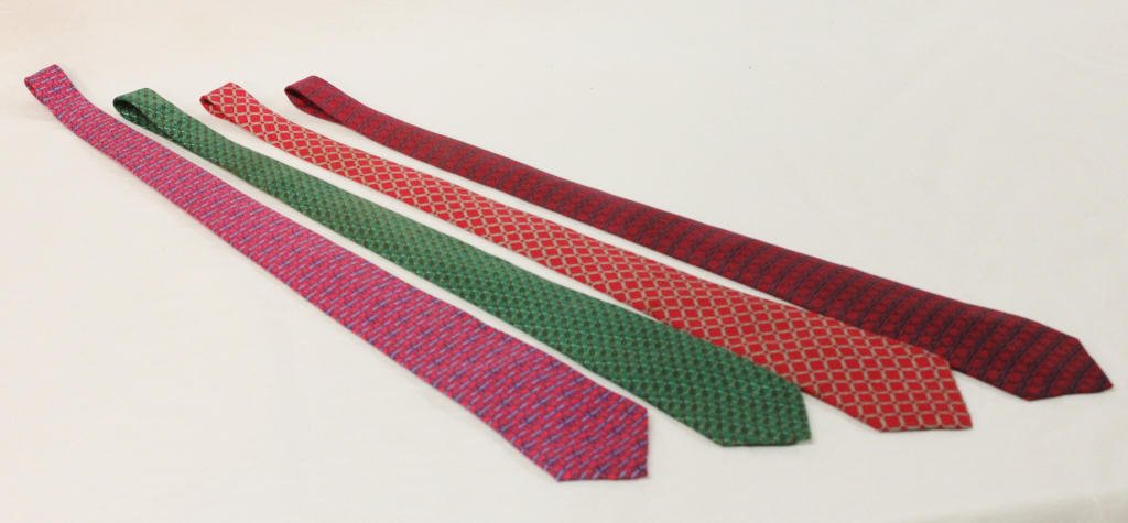 Group of Four Hermes Ties: In various colorful patterns. Length 56 Inches Width 3.5 Inches