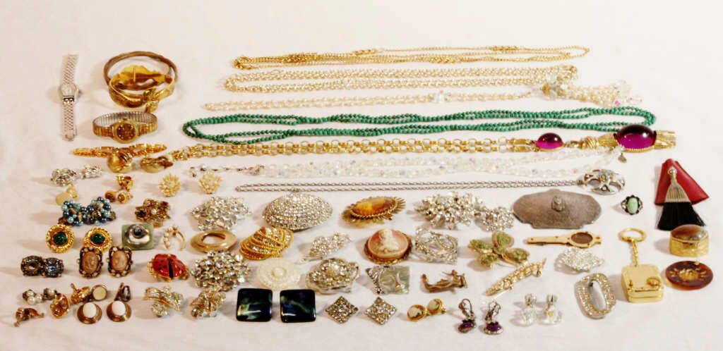 Box Lot of Costume Jewelry: Assorted pins, necklaces, bracelets. From an estate in Mamaroneck, NY