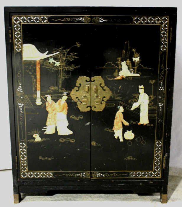 Chinese Two-Door Black Lacquer Chest: With brass fittings. Painted details and raised Chinese figures. Height 30 Inches Width 24 Inches Depth 12 Inches