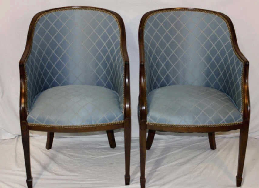 Pair of Upholstered Louis XV Style Bergeres: Mahogany scoop back bergere chair with blue upholstery. Height 34.5 Inches Width 23 Inches Depth 18 Inches