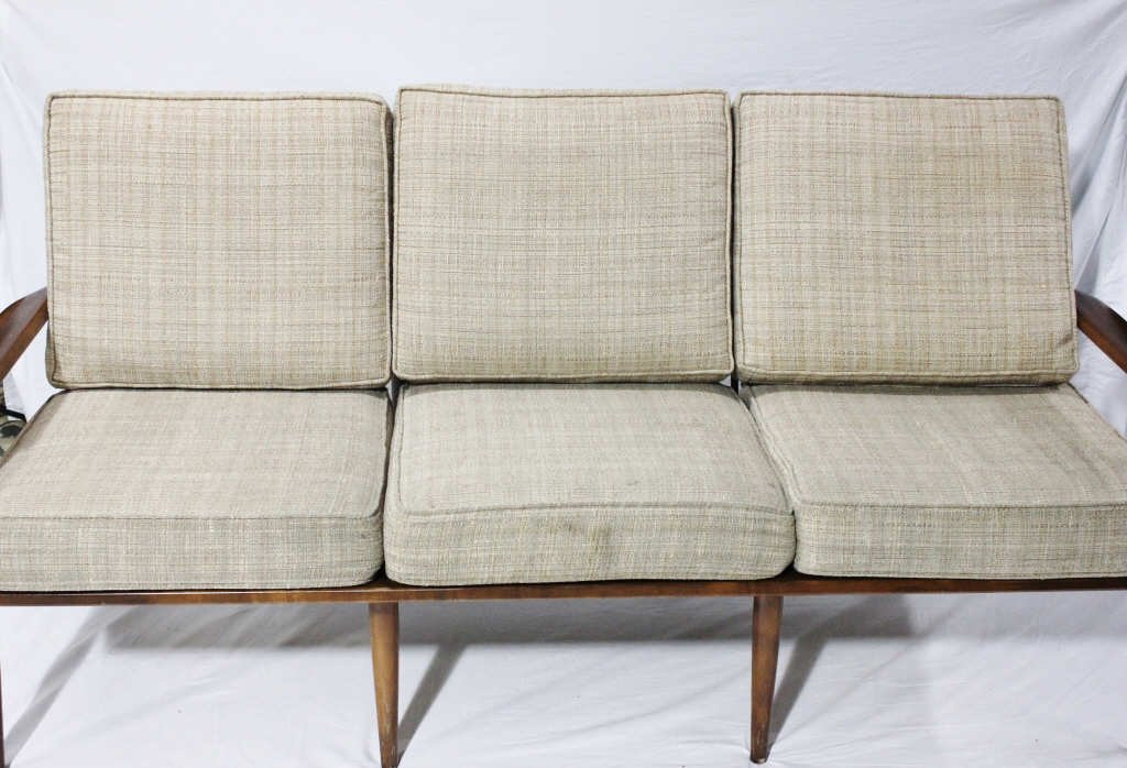 Mid-Century Teak Sofa: Three seat cushions. Height 29 Inches Width 67 Inches Depth 30 Inches.