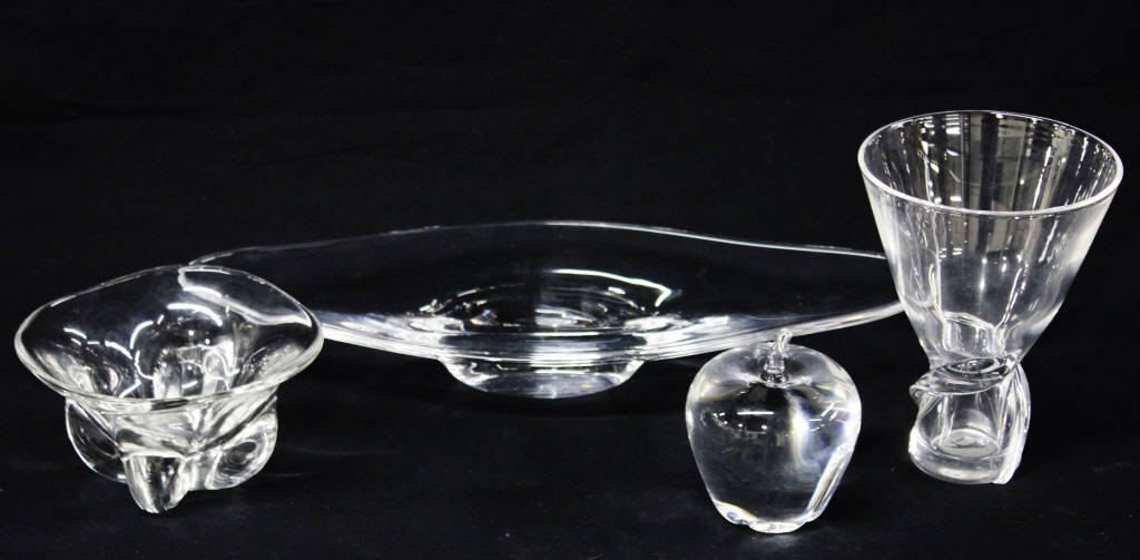 Group of Four Steuben Glass Articles: An apple, a vase, a round dish, and an oblong dish. Height of vase 6.5 Inches Diameter 5 Inches. Oblong dish length 16 Inches width 6.5 Inches