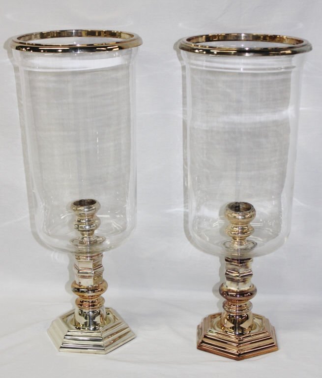 Pair of Ralph Lauren Hurricane Candleholders: Two silver tone candleholders with crystal hurricane shade. Height 21 Inches, Diameter of shades 8.5 Inches
