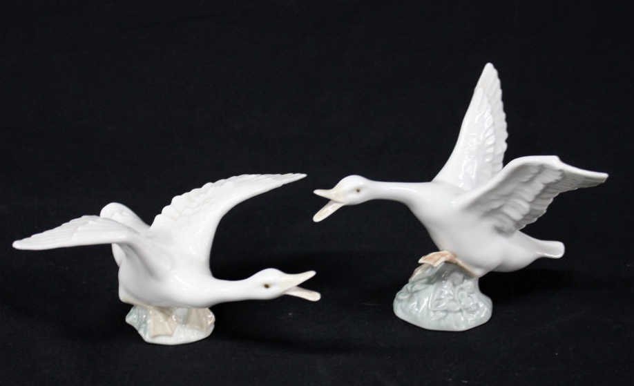 Pair of Lladro Porcelain Geese in Flight: Two white ducks or geese, with wings spread. Height 4.5 Inches Width approximately 6 Inches Depth approximately 6 Inches