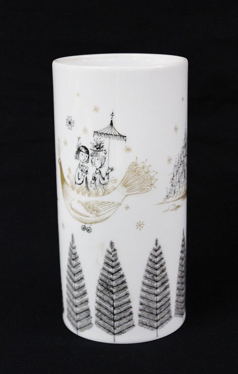 Rosenthal Vase Design by Raymond Peynet: Drawings of couple in bird-shaped vehicle, a city skyline, and lined on the bottom with trees. From an estate in Mamaroneck, NY Height 7 Inches Diameter 3.5 Inches