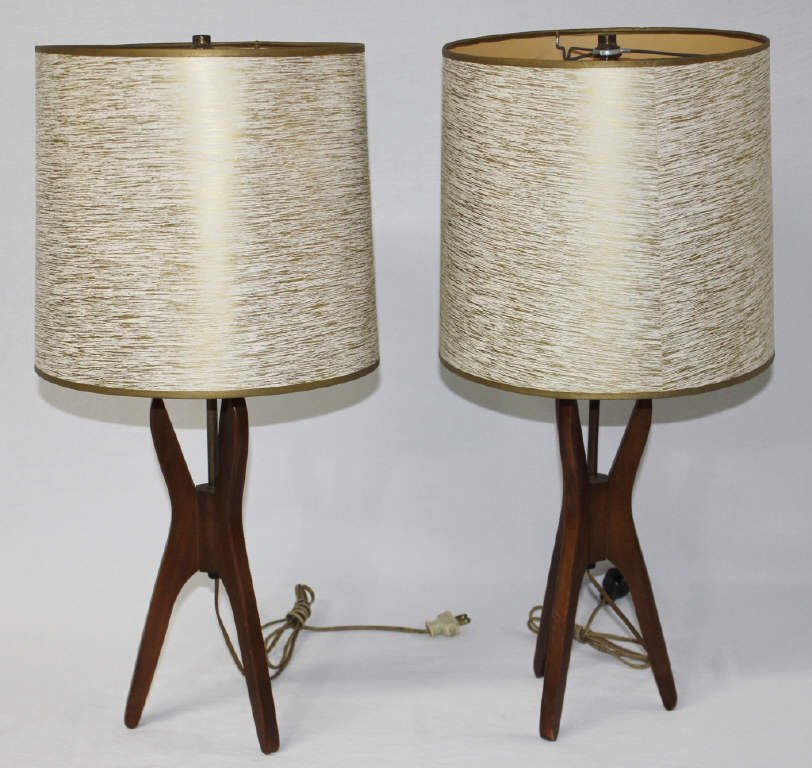 Pair of Mid-Century Modern Tripod Table Lamps: With original paper shades. Ca. 1940 Height 25 Inches Width of stand 4.5 Inches. Height of shade 11 Inches Diameter of shade 11 Inches