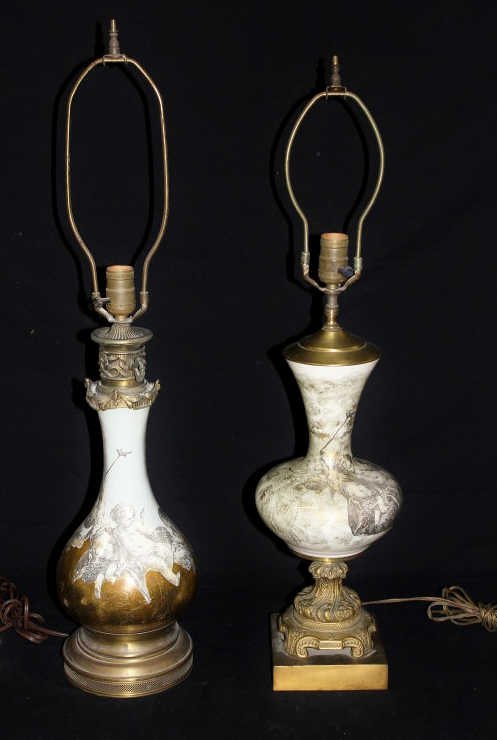 Two Glass Cherub Print Gold Leaf Table Lamps: One slightly cracked. A light blue with cherubs around the bottom, and a gold and white patterned print with cherub. Height of tallest 19 Inches Largest diameter approximately 7.5
