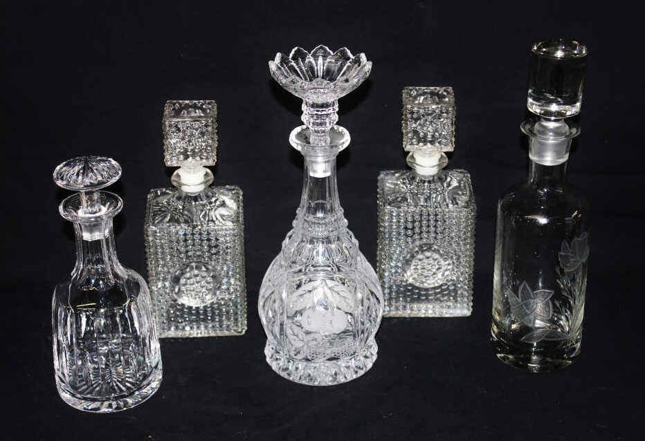 Five Glass and Crystal Decanters: Tallest Height 10.5 Inches, not including stopper. From an estate in Mamaroneck, NY