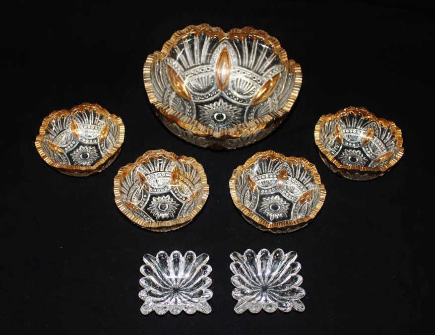 Group of Seven Heisey Glass Articles: Four small bowls, one large, and two small square dishes. Bowls cut glass with gold colored scalloped rim. From an estate in Mamaroneck, NY Large bowl Height 3.75 Inches Diameter 8.5 Inches Small bowl