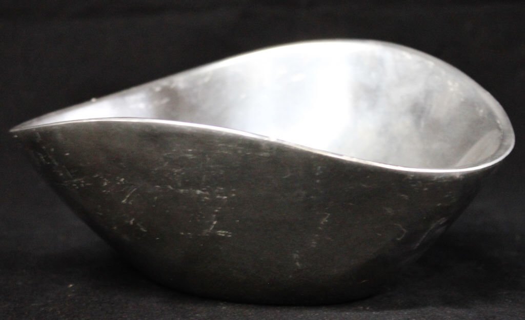 Nambe Bowl and Napkin Rings: Six napkin rings in original box. Bowl copyright 1967