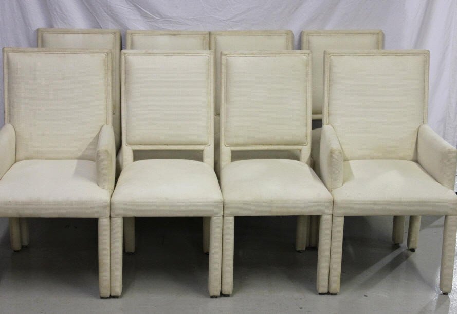 8 Parson Style Upholstered Dining Chairs: Two arm chairs and six side chairs. Upholstered in neutral off-white fabric. Height 41 inches. Width 18 inches. Depth 24 inches.