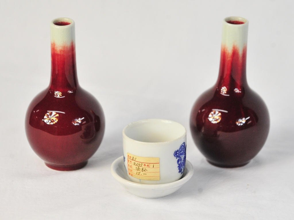 Two Chinese Sang de Boeuf Vases and Cup w Saucer: Vase Height 5.5 Inches Diameter approximately 4 Inches Cup Height 2 Inches Diameter 2 Inches Saucer Height approximately 1 Inch Diameter 3 Inches
