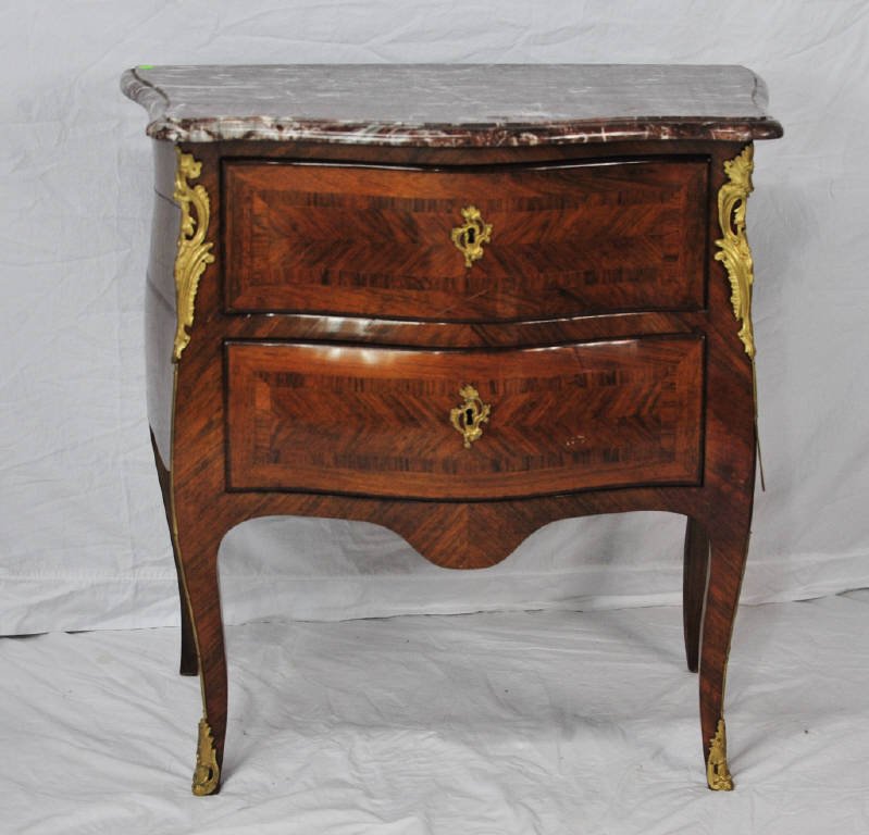 Marble Top French Commode Circa 1850: With bronze mounts, two drawers Height 33 Inches Width 31.5 Inches Depth 19 Inches