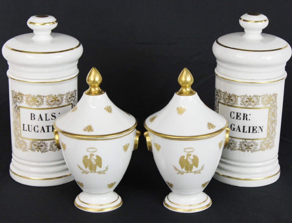 Four Limoges Porcelain Items: Two white and gold Limoges cache pots, two Limoges medicine jars. Cache Pots Height with lids 9 Inches Medical Jars Height 11 Inches