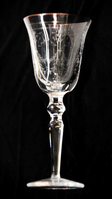 Sixteen Waterford Wine Glasses: Gilt rimmed and etched, with Wateford mark on bottom. Eight white wine glasses and eight red wine glasses. White Height 8 Inches Red Height 8.5 Inches